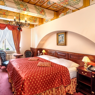 Pohodlné postele hotelu U Zlatého Stromu